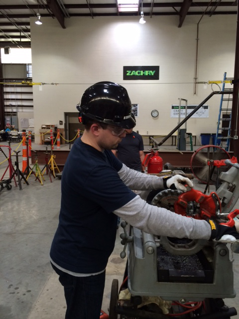 Sean Thurman being trained in pipefitting 